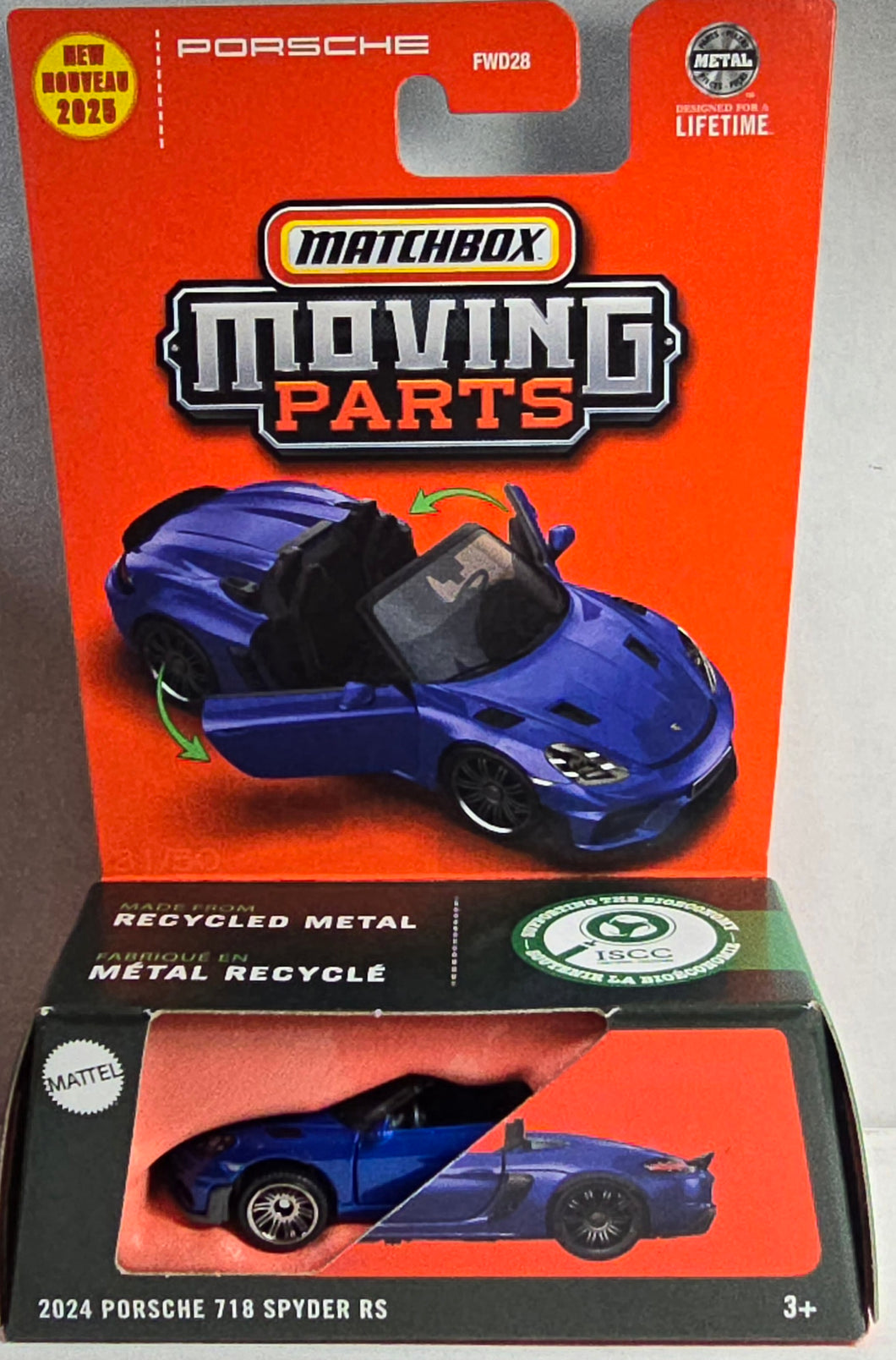 Matchbox Porsche 718 Spyder RS toy car in packaging with orange background